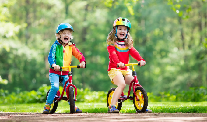 kids playing on balance bikes