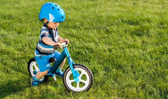 toddler riding balance bike